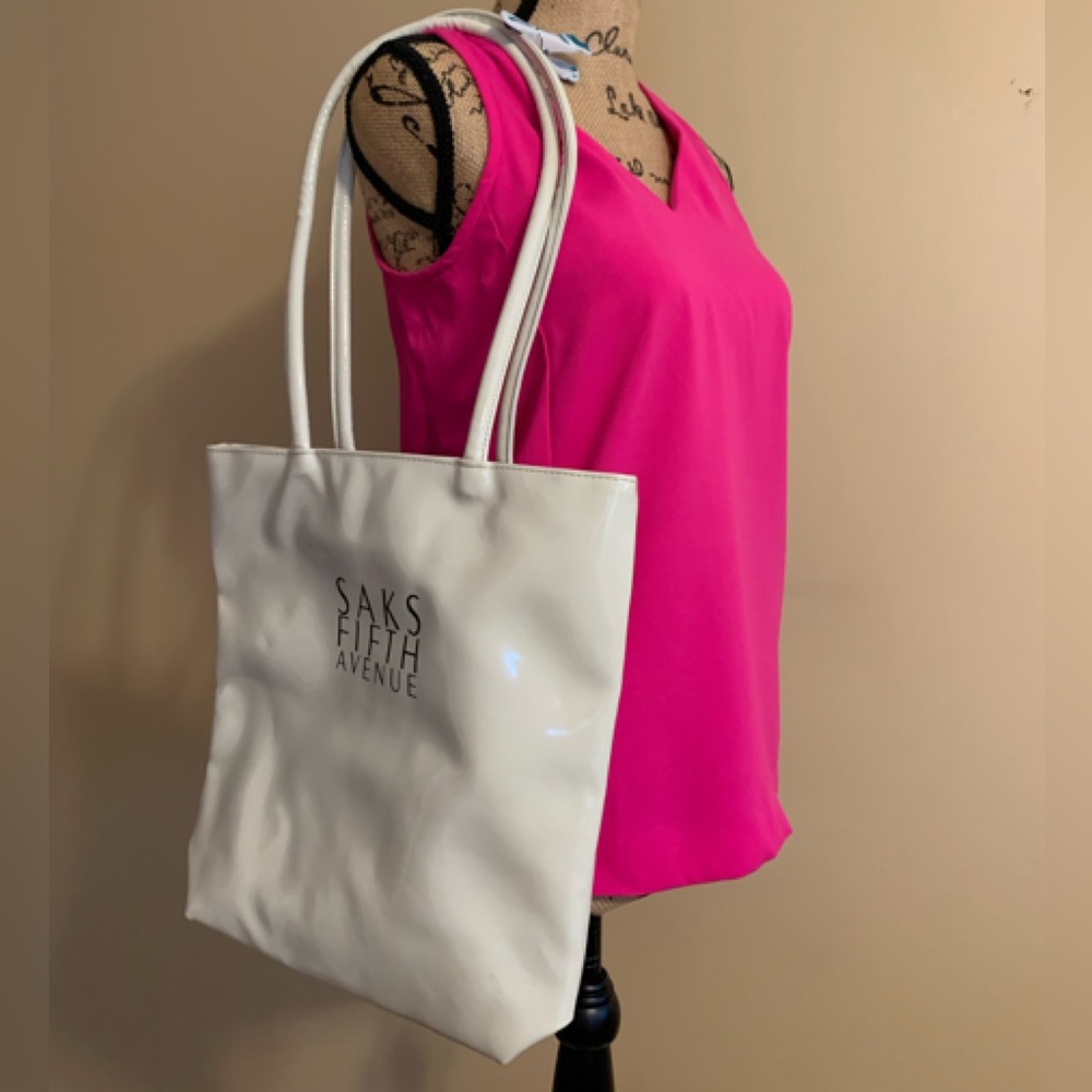 SAKS Fifth Avenue crème’ color double handle Vinyl tote with Black logo …